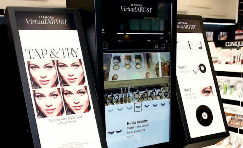 Augmented reality try-on tools in a make-up shop.
